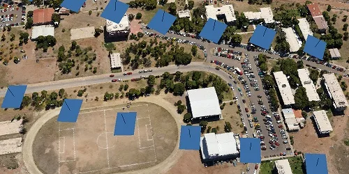 Computed camera positions over an aerial image of a neighbourhood